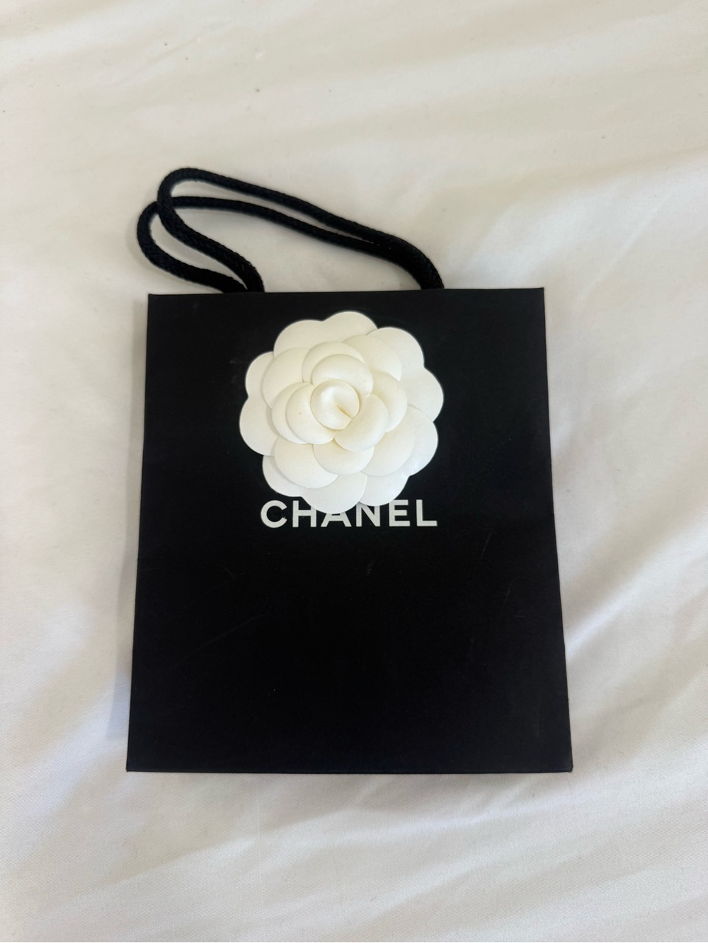 CHANEL Black Paper Gift Bag with White Camellia Accent (small)